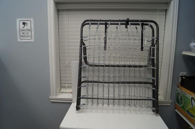 lot 21 image: a cot and suitcase...