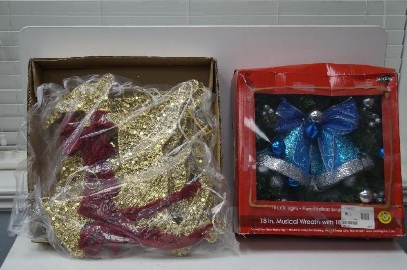 lot 24 image: a wreath and lighted up raindeer...