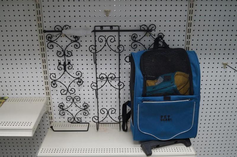 lot 29 image: wall hangers and a pet back pack...