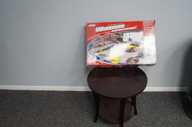 lot 30 image: a coffee table and a wire car speed...