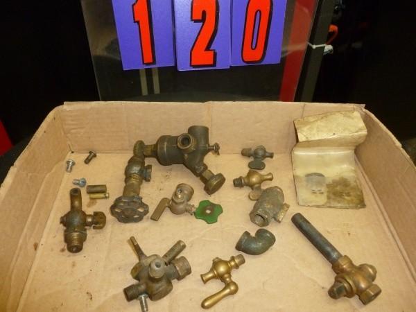 Flat of vintage gas engine valves. ...