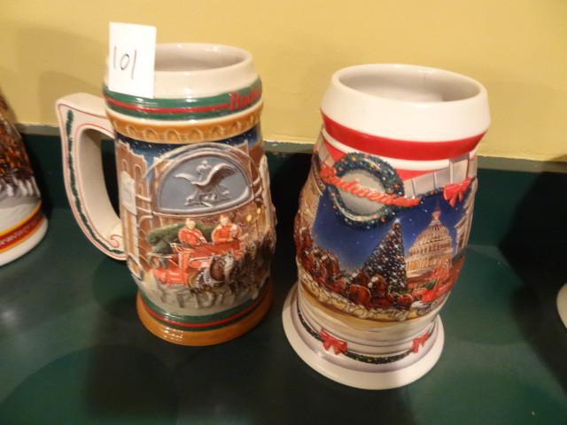 2 Budweiser holiday steins. 1997 an...