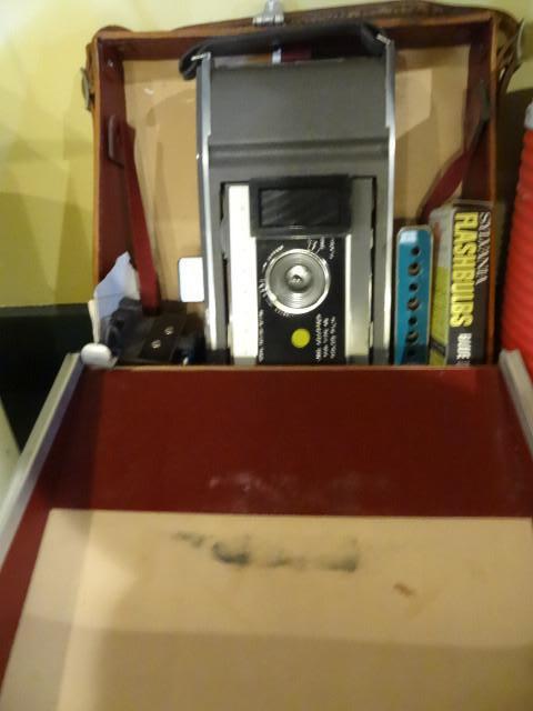 Vintage Polaroid camera with case. ...