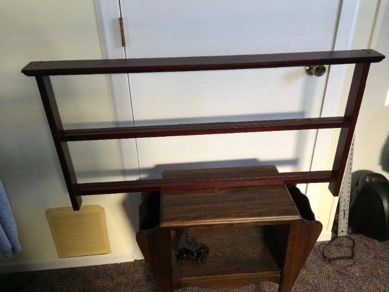 Plate display case holds eight plat...