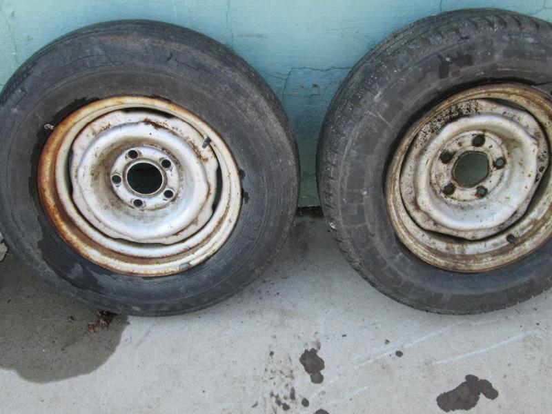 lot 25 image: Set of 2 Ford rims and tires, small...