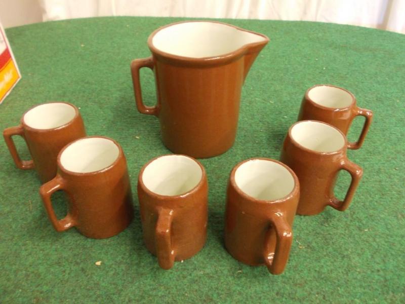 lot 53 image: Brown Pottery Pitcher With 6 Mugs...