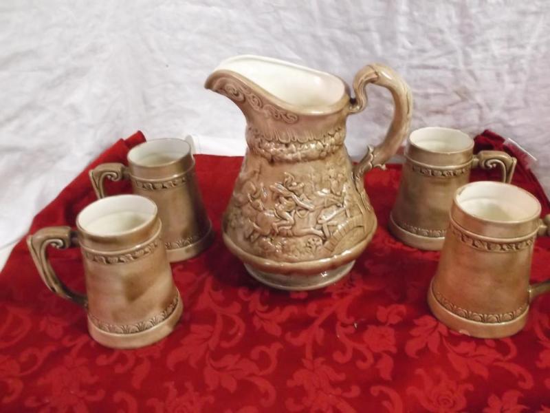 Nice pitcher with 4 mugs 3 of the m...