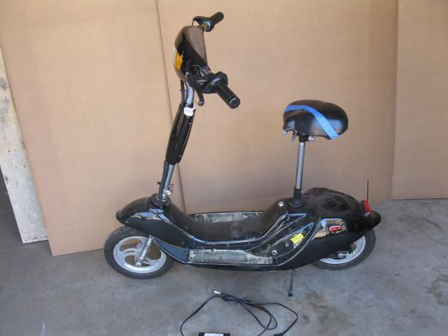 lot 18 image: Scooter, works with charger, seat n...
