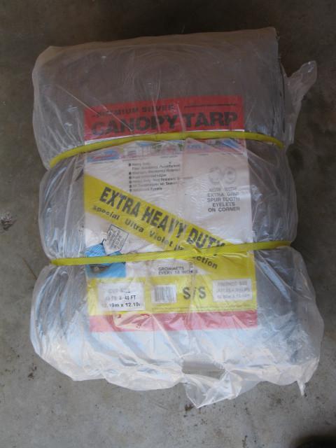 lot 26 image: Tarp, new in bag, 40x40...