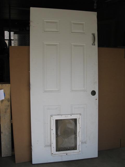 lot 43 image: Service door with pet access door, ...