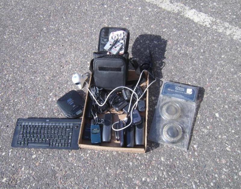 Box of cell phones home phones cd p...
