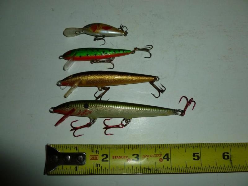 lot 101 image: Lot of three&nbspRapala and a unma...