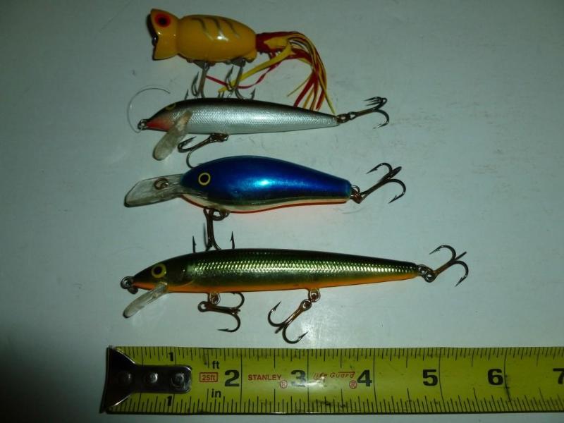 lot 106 image: Lot of three&nbspRapala and a Hula...