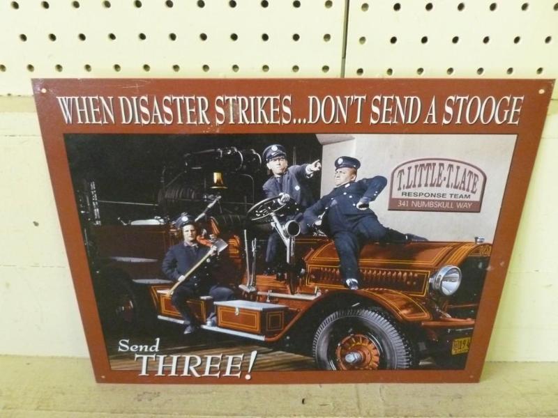 lot 149 image: Three Stooges metal sign that measu...