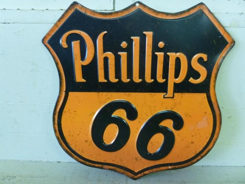 lot 22 image: Phillips 66 embossed metal sign tha...