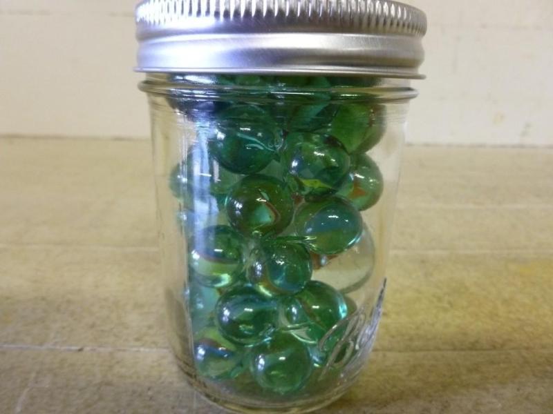 lot 44 image: Ball canning jar filled with vintag...
