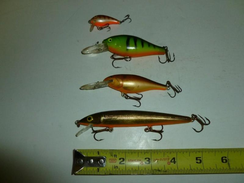 lot 98 image: Lot of three&nbspRapala and a unma...