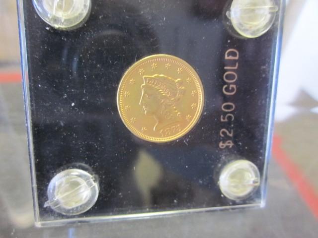1873 $2.50 gold coin....