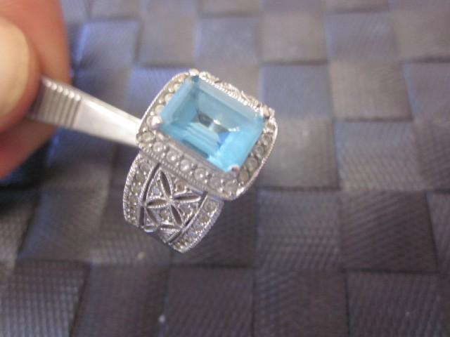 White 14 karat gold ring with blue ...