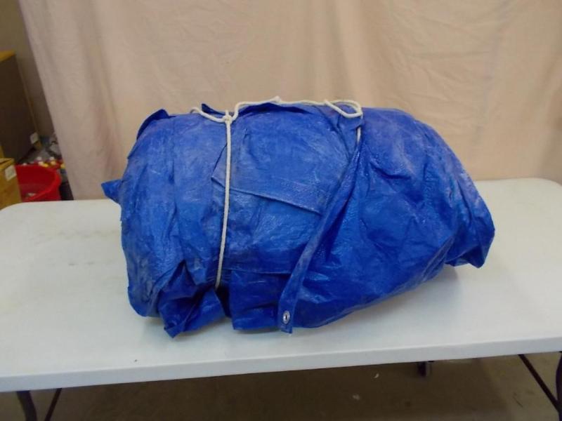 Large blue tarp that came to us rol...
