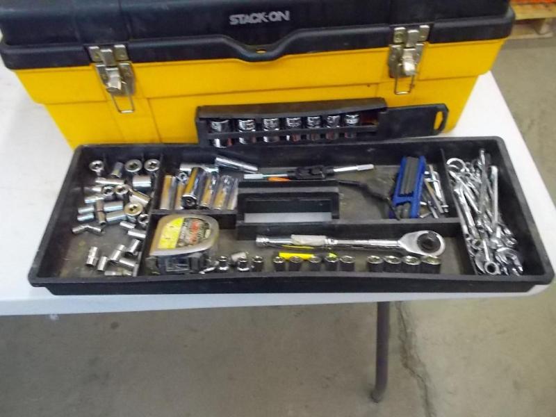 A hard plastic tool box filled with...