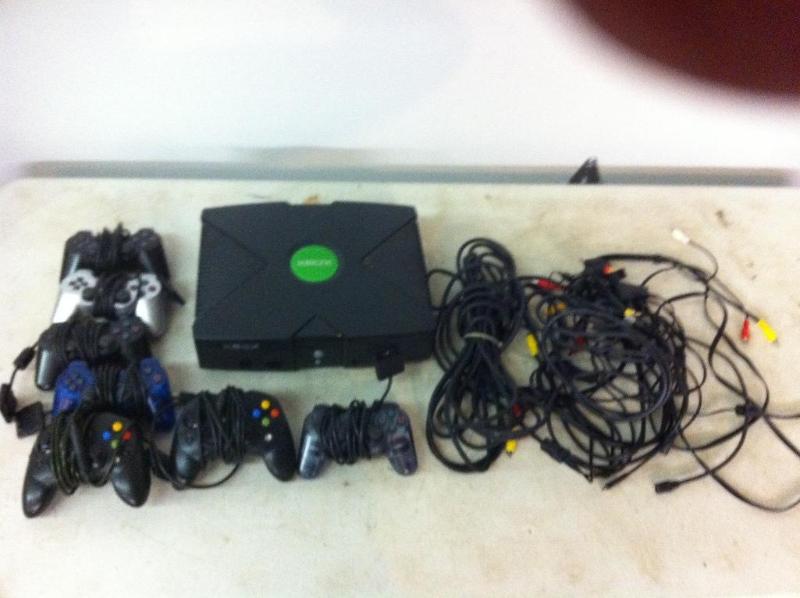 X Box with 7 controllers and some c...