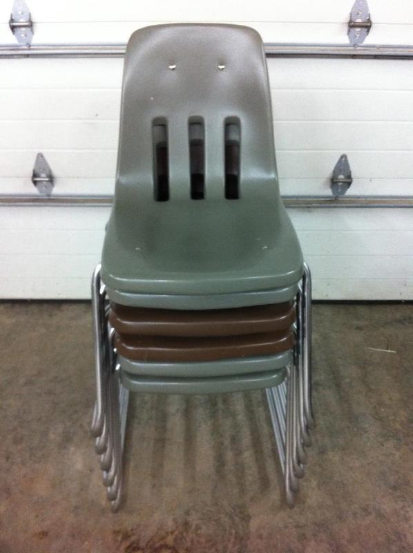6 stackable chairs. 2 brown and 4 g...