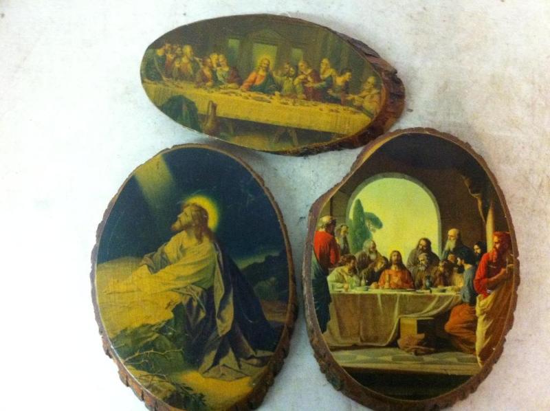 3 religious prints on slab wood....