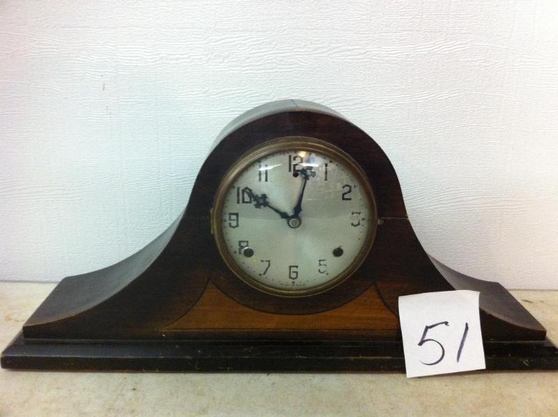 Mantel clock. Missing back. May nee...