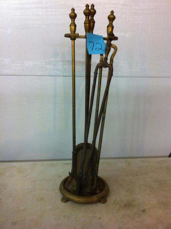 Brass fireplace set. Appears to be ...