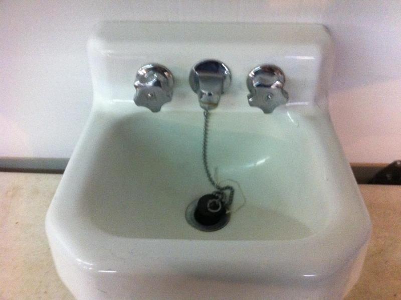 Vintage white porcelain over cast i...