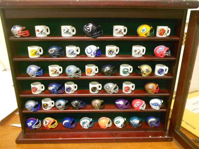 Display case of NFL Football helmet...