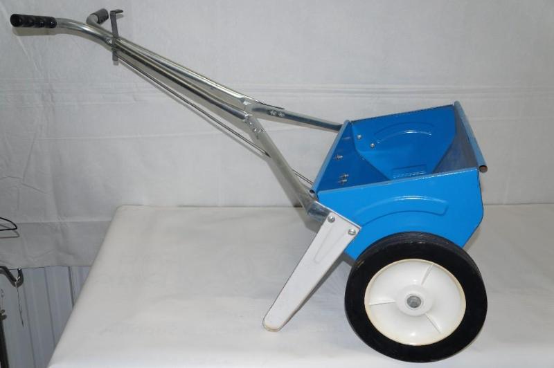 lot 37 image: Red Devil lawn seed spreader. It is...