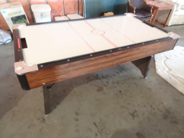 lot 3 image: Air hockey table. 110 volt. Comes w...