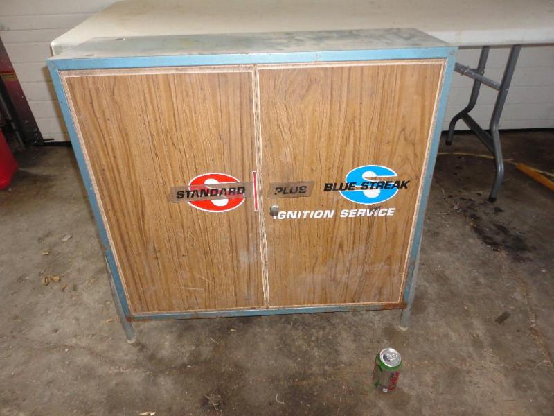lot 21 image: Cabinet full of spark plugs, see pi...
