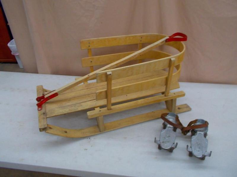 lot 42 image: A wooden sled and a pair of vintage...
