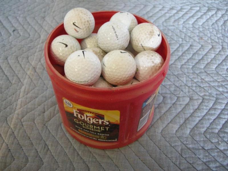 lot 107 image: Mostly Nike golf balls. Decent, dus...