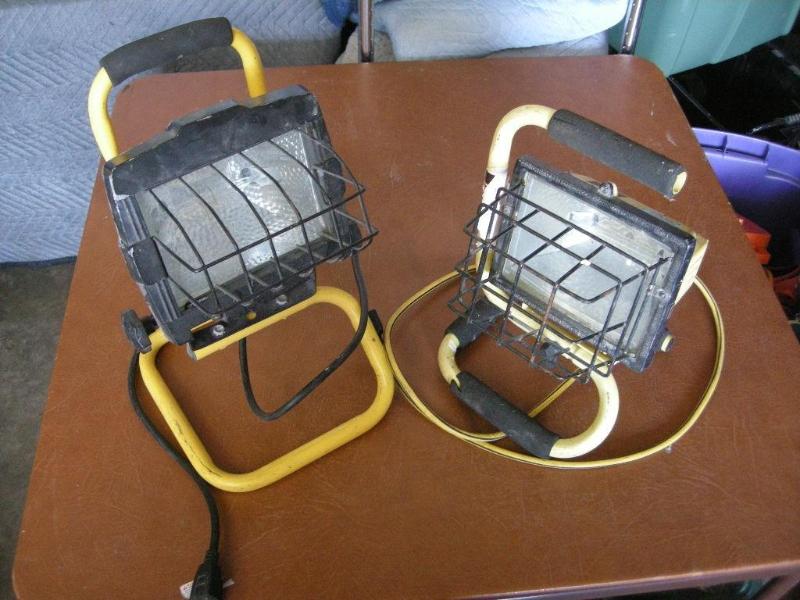 lot 73 image: 2 portable shop lights. Both lit up...