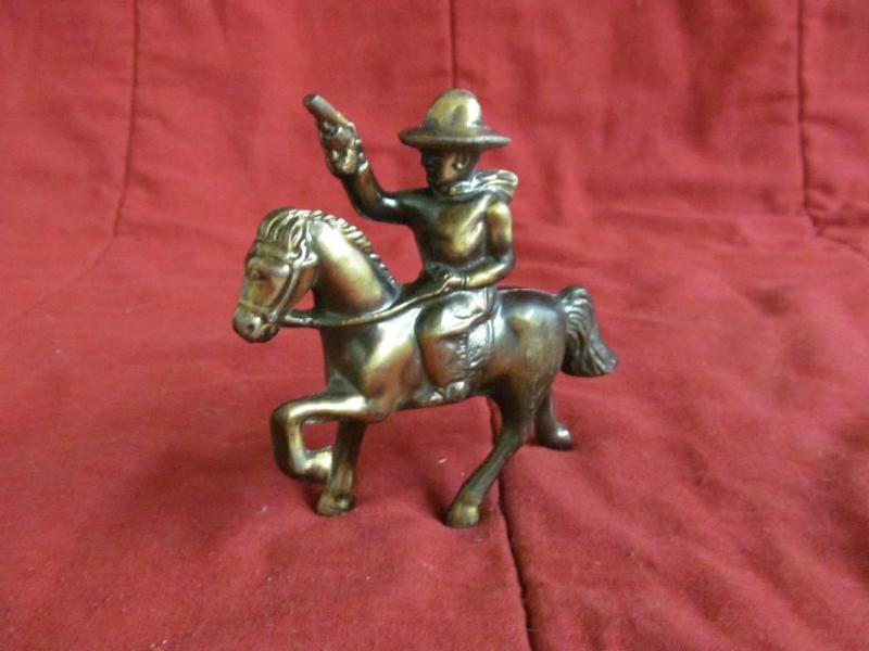 lot 100 image: Metal Horse, cowboy with gun...