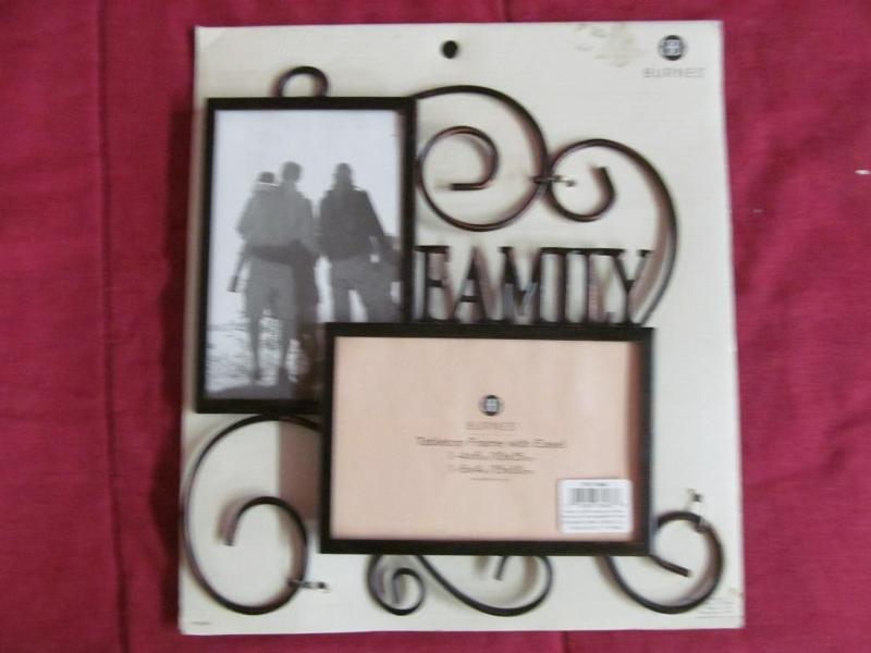 lot 83 image: Black metal tabletop Family Picture...