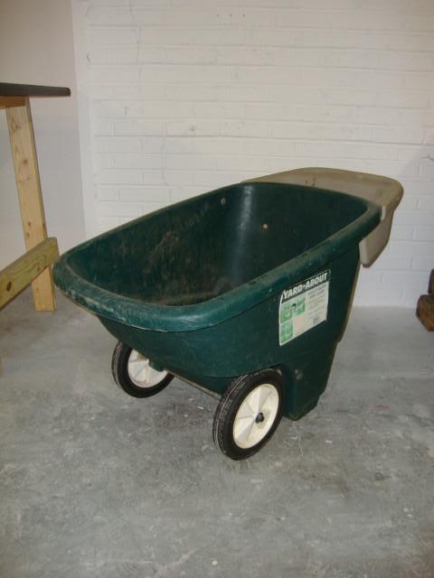lot 44 image: Yard About 6 cu ft Wheel Barrel...