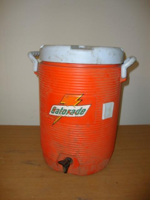 lot 82 image: Rubbermaid 5 Gallon Cooler Dispense...
