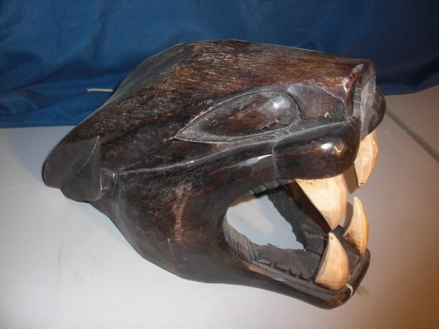 Wooden Black Panther Head.. No idea...