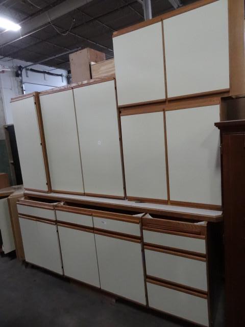 lot 10 image: 9 piece kitchen cabinet set...