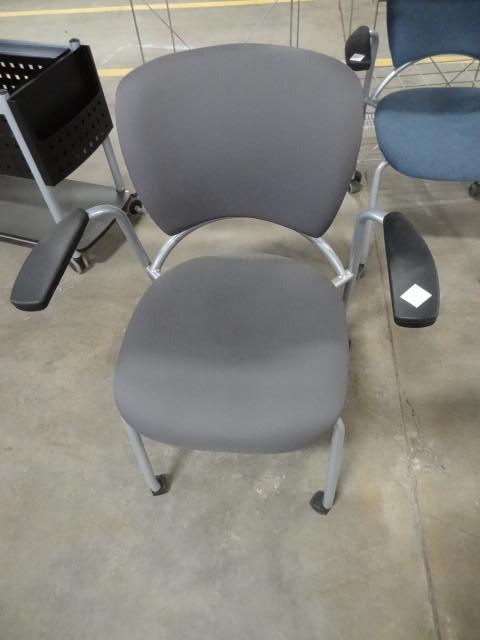 lot 113 image: Metal framed side chair on wheels....