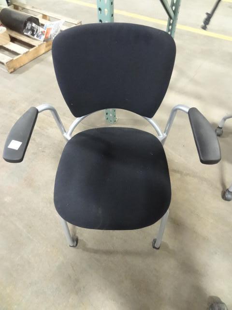 lot 128 image: Metal framed side chair on wheels....