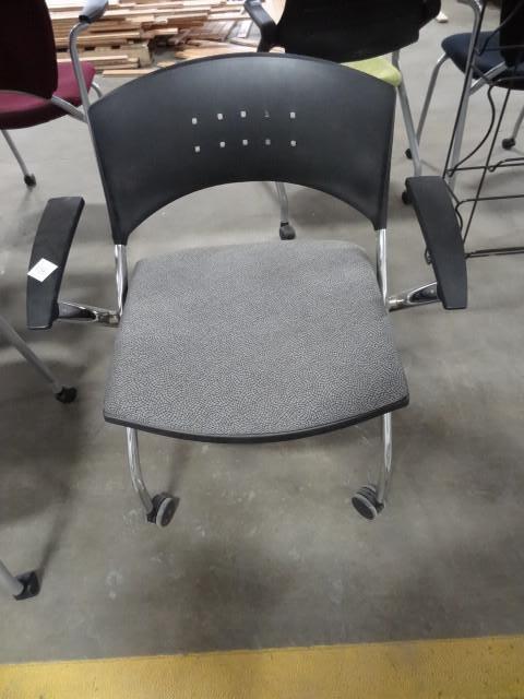 lot 156 image: Metal framed side chair on wheels....