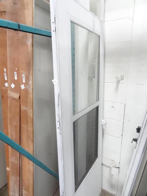 lot 211 image: Aluminum storm door. 31 x 80...