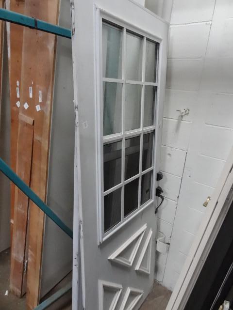 lot 212 image: Aluminum storm door. 31 x 80...