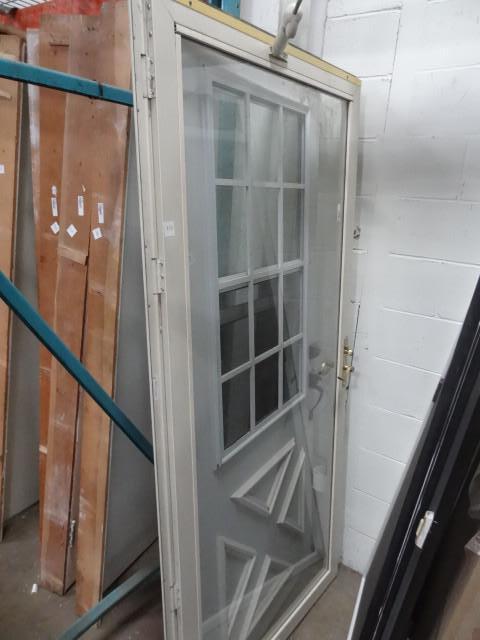 lot 213 image: Aluminum storm door. 36 x 79...